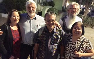 From left to right, Mary Roberts, Jeff Roberts, Jamartin Sihite, Richard Elliott, JoAnn Yee take a moment to snap a group photo during a night on the town in Davis.